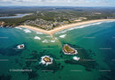 Scenic Aerial View of Turquoise Ocean and Sandy Beach with Rocks and Islands