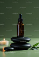 Amber Glass Dropper Bottle with Spa Stones and Candle for Wellness