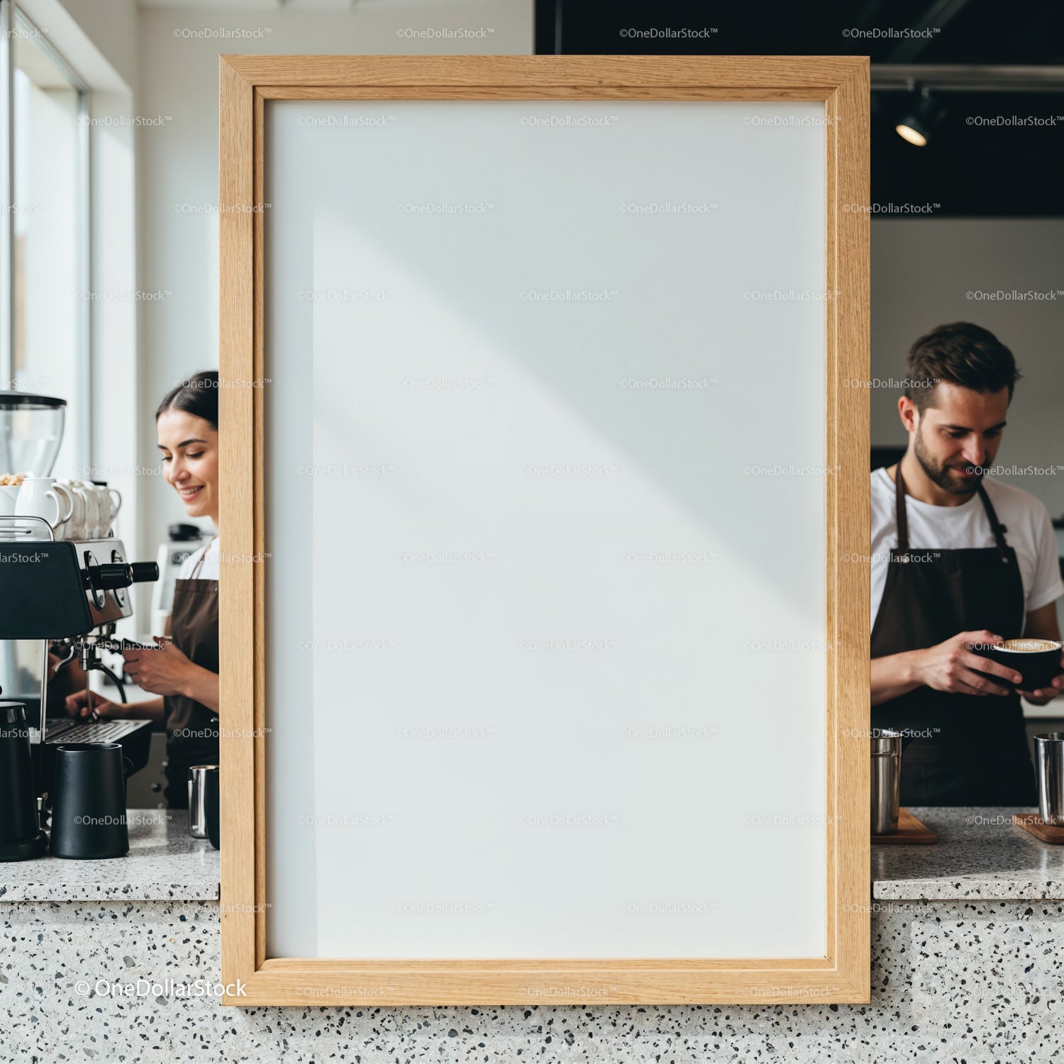 Baristas crafting coffee behind blank wooden frame