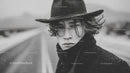 Moody Black and White Portrait of a Young Man in Cowboy Hat