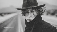 Moody Black and White Portrait of a Young Man in Cowboy Hat