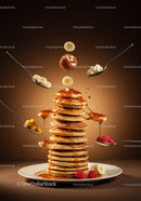 Stack of fluffy pancakes with fresh fruit and syrup