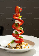 Fresh strawberries with cream and basil on crumble
