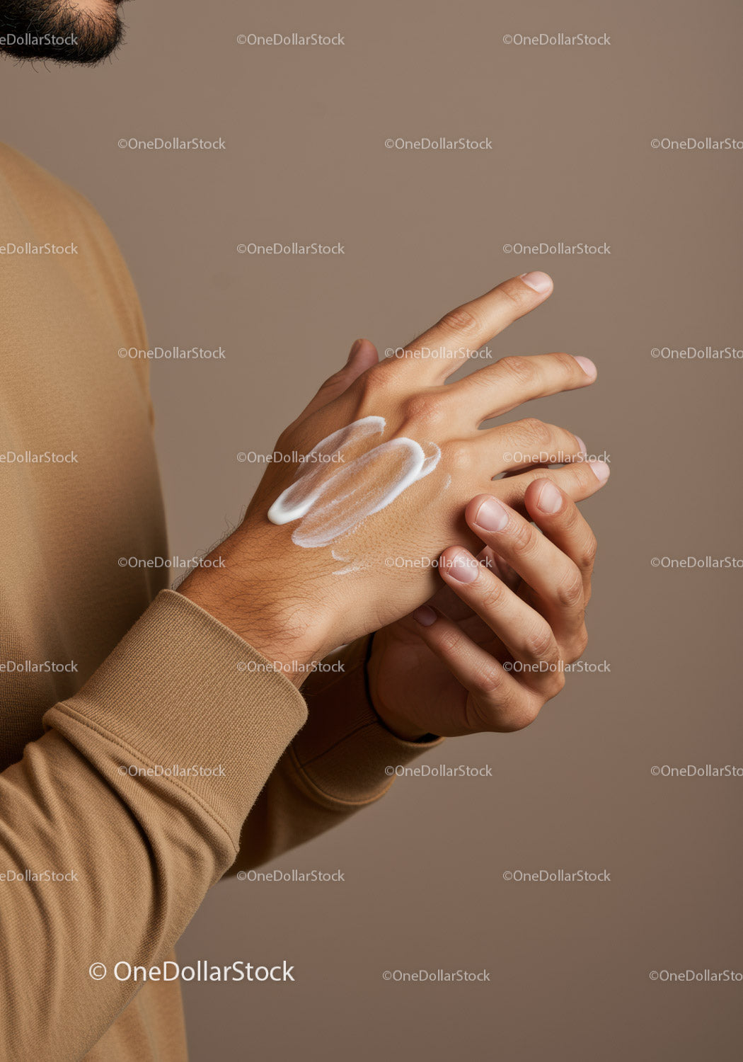 Close-up of Hands Applying White Lotion for Skin Hydration and Care
