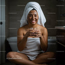 Happy Woman with Facial Mask Wearing Towel in Bathroom