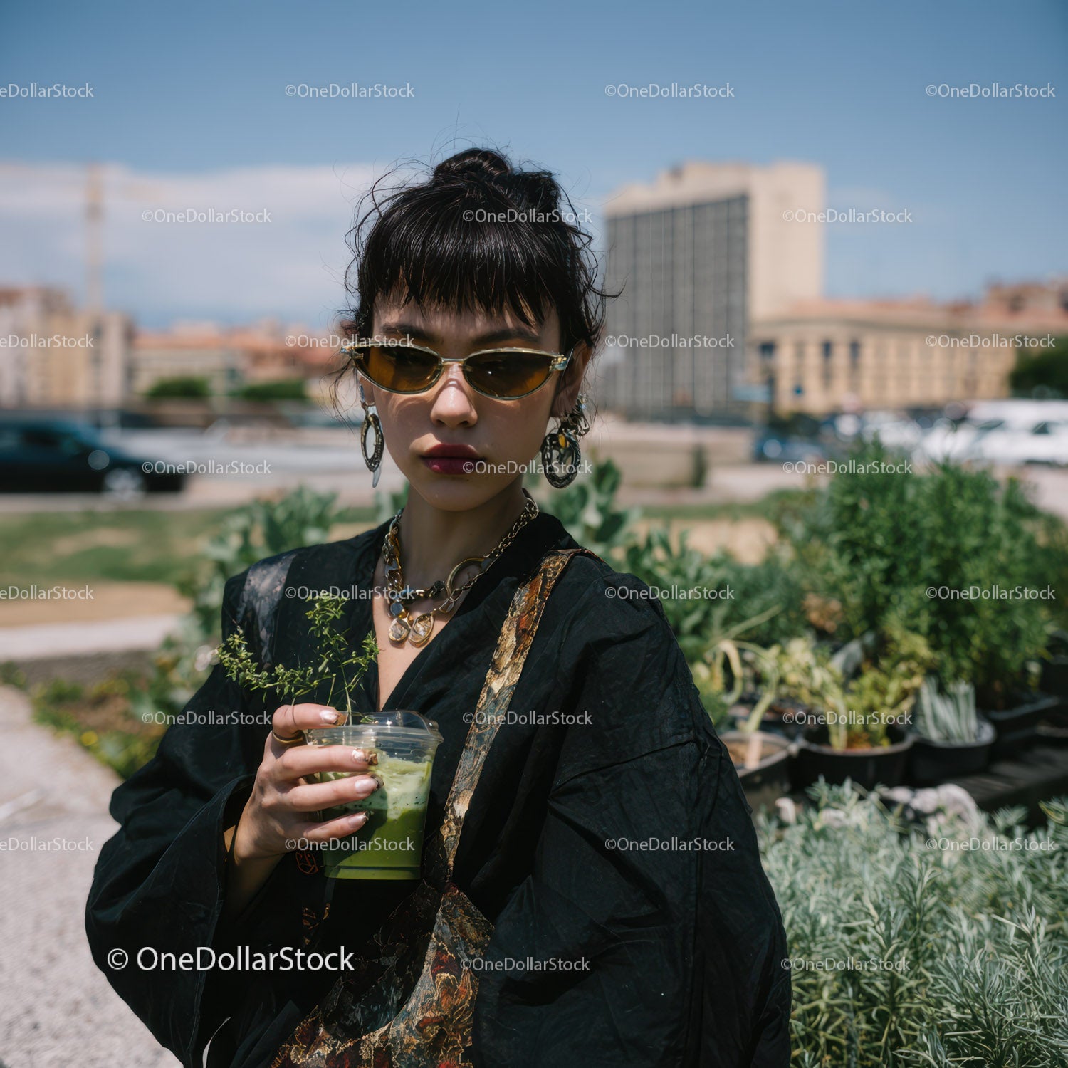 Fashionable Woman with Short Dark Hair and Green Smoothie on Rooftop