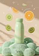 Green bottle on soft textured surface with floating fruits
