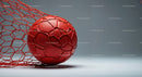 Red Soccer Ball with Protective Net on Gray Surface