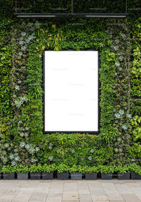 Urban vertical garden with empty white frame in city space