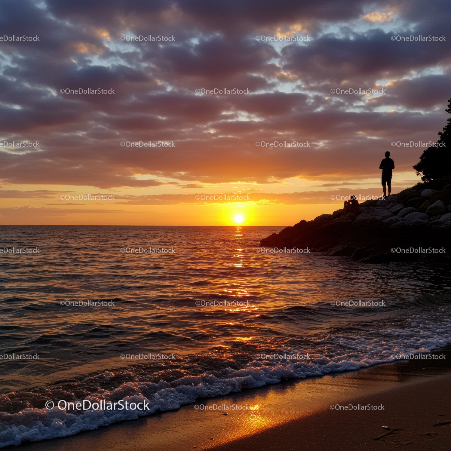 Beautiful Sunset over Calm Ocean with Silhouette of Person and Rocks