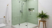 Modern Bathroom with Glass Shower and Green Tiles