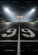 Empty running track lanes illuminated at night stadium
