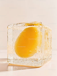 Fresh Lemon Slice Encased in Transparent Ice Cube