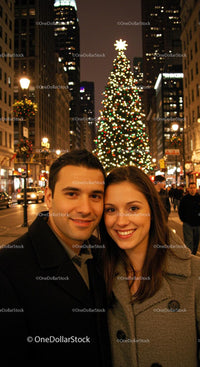Happy couple enjoying festive night in city street