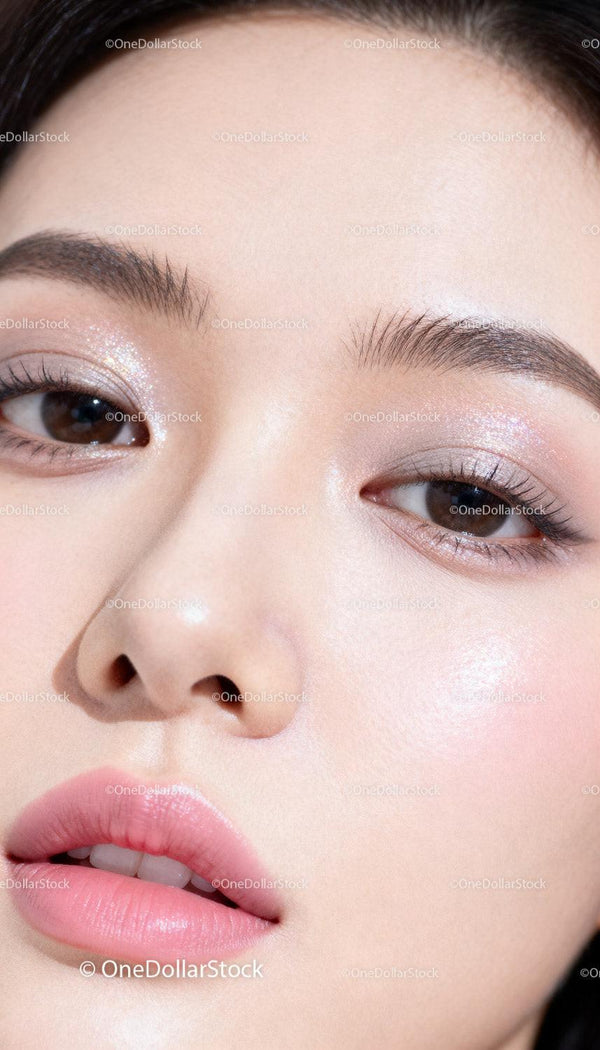 Close-up of woman with glowing natural makeup look