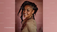 Joyful Smiling Woman with Braids and Golden Jewelry Portrait