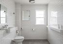 Bright Modern Bathroom with White Subway Tiles and Natural Light