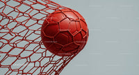 Red Soccer Ball in Goal Net with Dynamic Sports Atmosphere