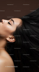 Closeup profile of serene woman with flowing black hair