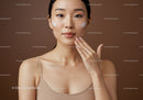Young Woman Applying Moisturizer for Radiant Glass Skin