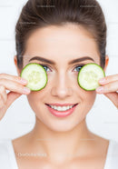 Woman with Fresh Cucumber Slices on Face for Natural Skin Rejuvenation