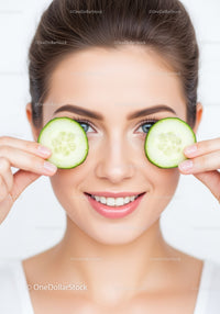 Woman with Fresh Cucumber Slices on Face for Natural Skin Rejuvenation