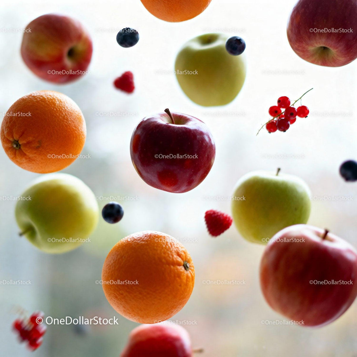 Fresh assorted fruits floating in soft daylight