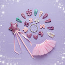 Sparkling fairy costume accessories on purple background