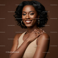 Beautiful Black Woman with Curly Hair and Warm Smile in Studio