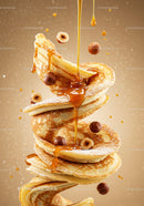 Stack of fluffy pancakes with hazelnuts and syrup drizzle