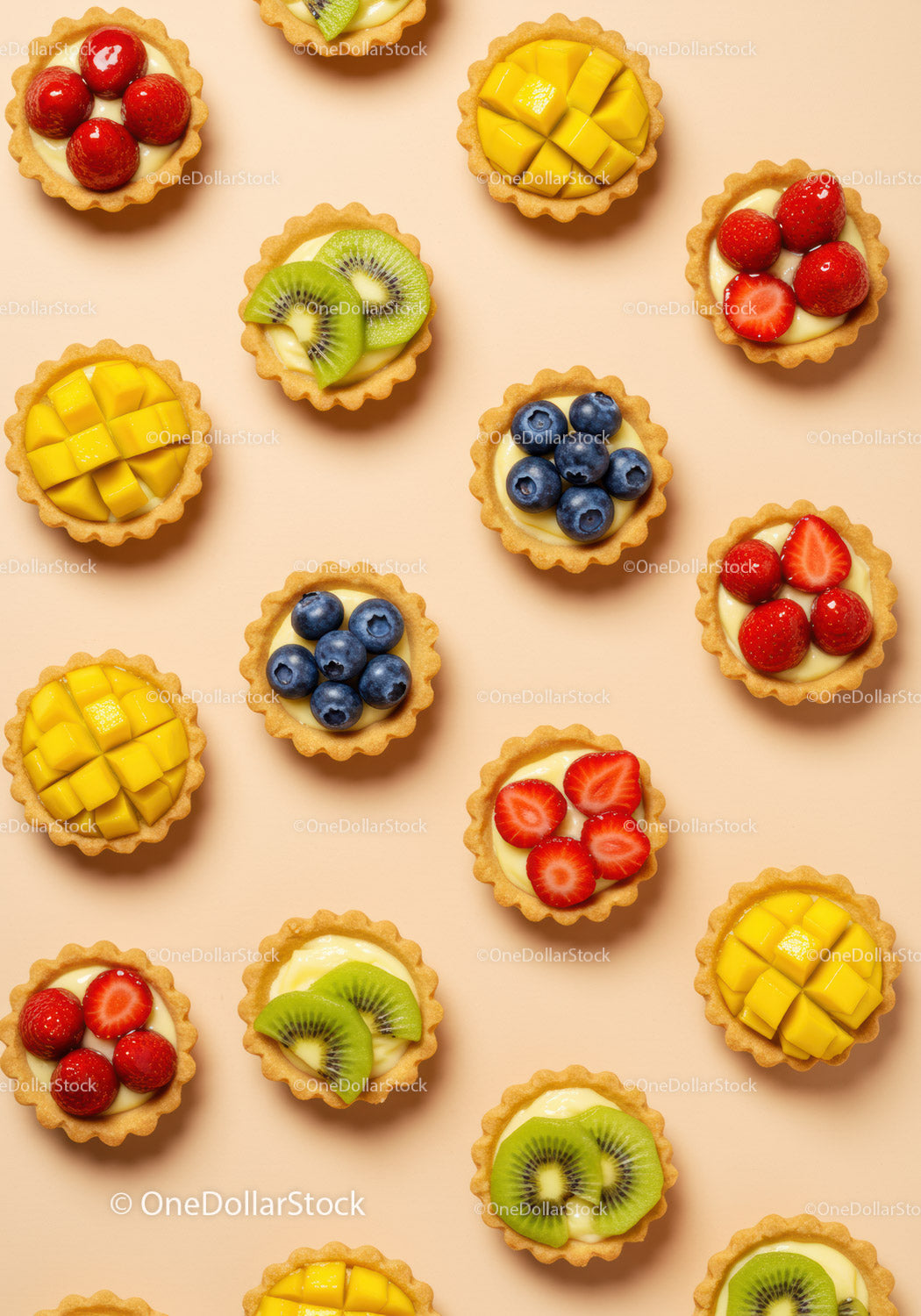 Mini fruit tarts with fresh berries and mango cubes