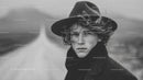 Stylish Young Man with Windy Hair in Artistic Black and White Portrait