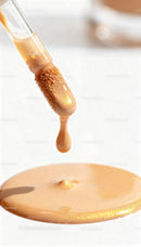 Close-up of foundation drop on applicator brush