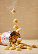 Mini Pancakes Sprinkled with Powdered Sugar in Motion