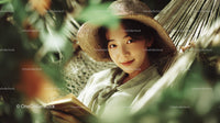 Woman Relaxing with Book in Green Garden Nature Scene