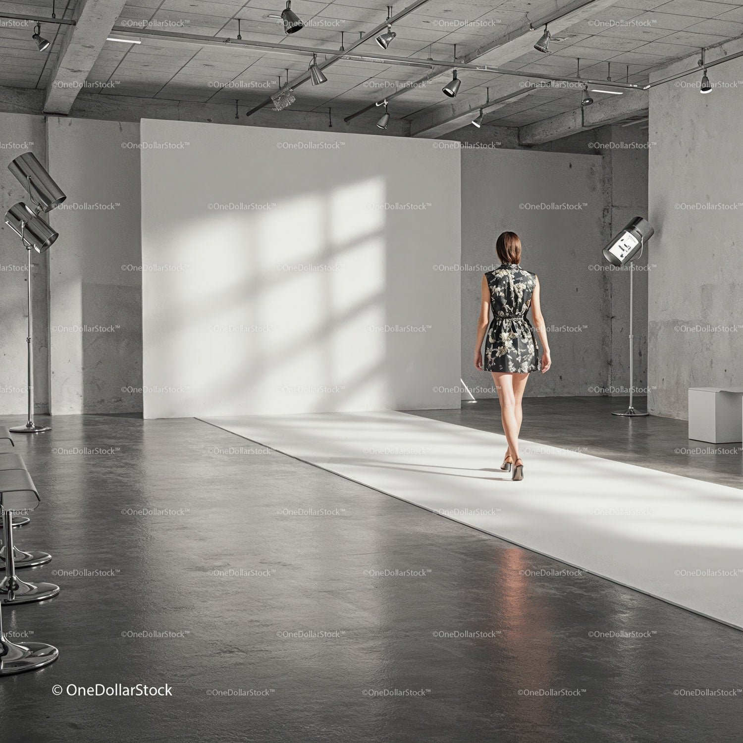 Fashion model walking runway in industrial photo studio