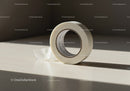 Roll of Transparent Adhesive Tape on Wooden Surface