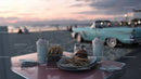 Beachside Vintage Car Scene with Milkshakes and Burger at Sunset
