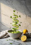 Fresh cucumber ribbons with herbs in rustic bowl