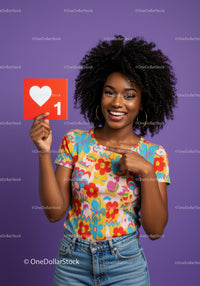 Smiling Young Woman with Heart Icon on Purple Background