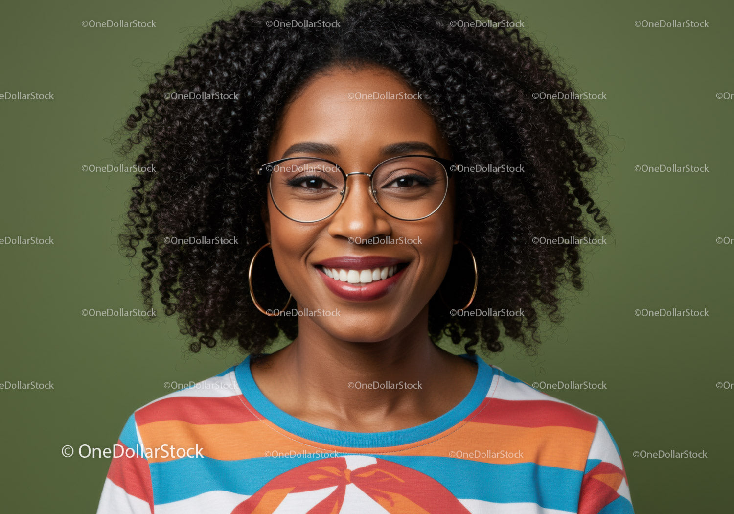 Smiling woman with curly hair wearing large hoop earrings and colorful striped shirt