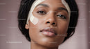 Close-up of Young Woman with Bandage on Cheek and Flawless Skin