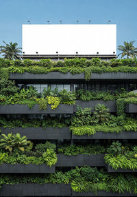 Modern building with lush vertical garden and blank billboard