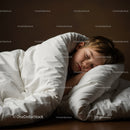 Peaceful child sleeping wrapped in white bedding