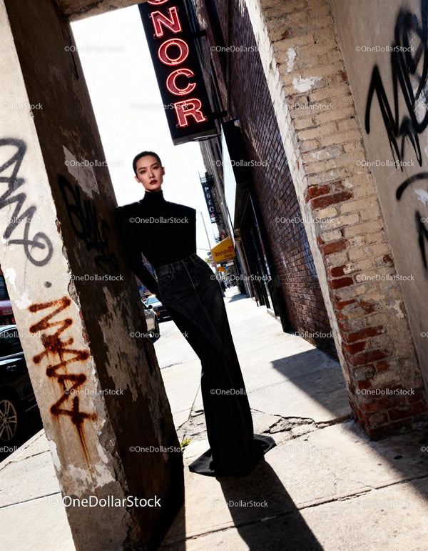 Elegant woman in black turtleneck on urban street