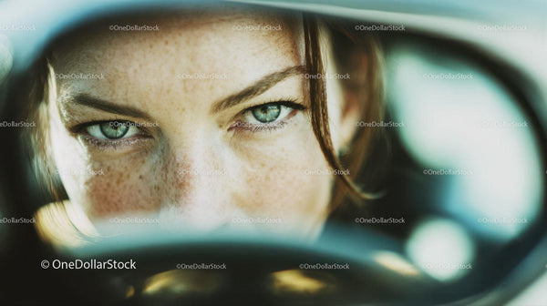 Intense Green-Eyed Woman Close-Up Portrait with Freckles in Natural Light