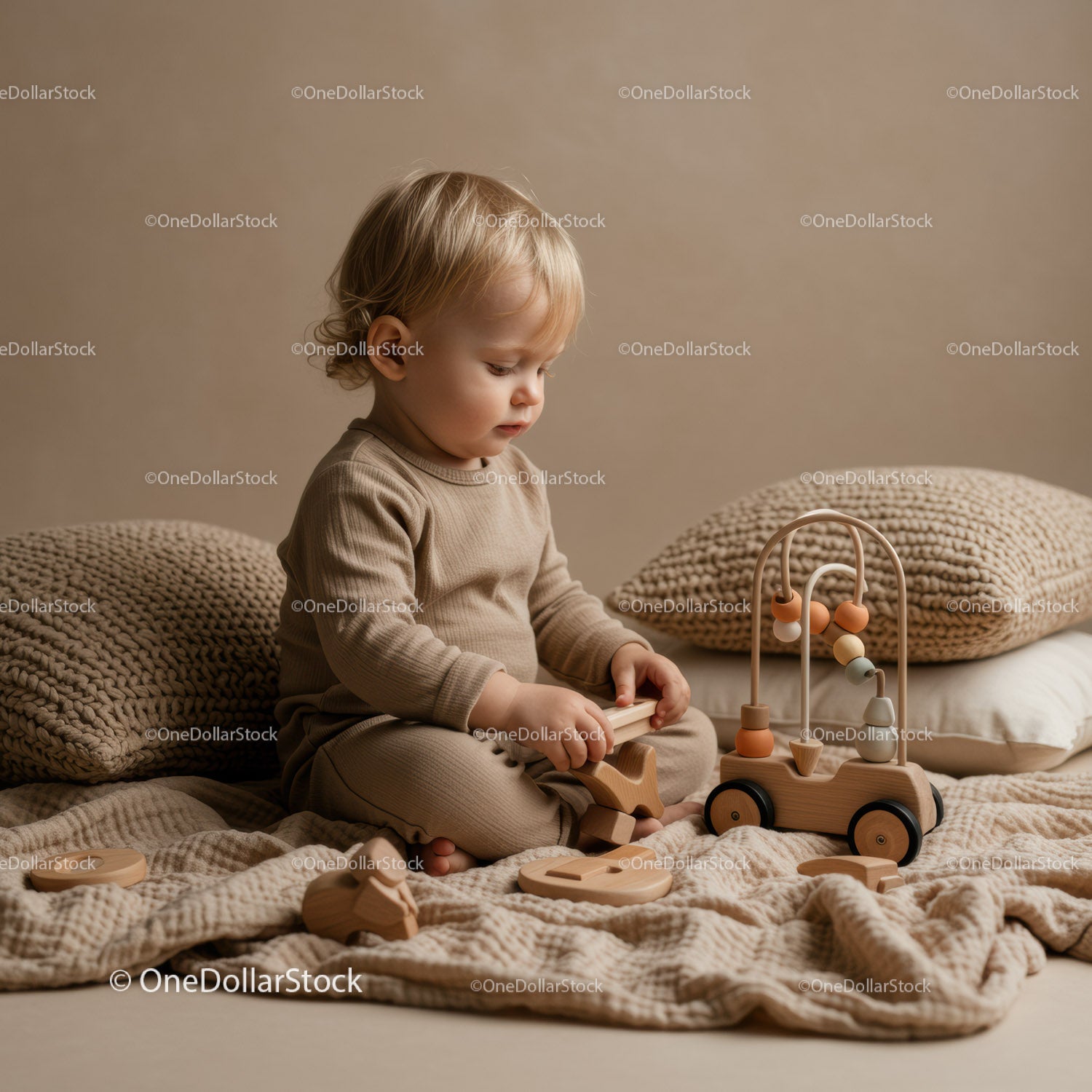 Toddler playing quietly with wooden toys indoors