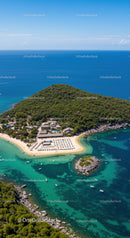 Tropical Island with Lush Greenery and Clear Blue Beach