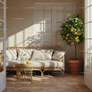 Cozy sunlit patio corner with rattan sofa and orange tree
