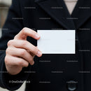 Person Holding Blank White Business Card Outdoors